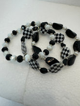 Set of 3 beaded bracelets in black and shades of white