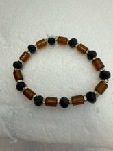 Set of 3 beaded bracelets in black and shades of gold