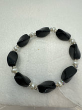 Set of 3 beaded bracelets in black and shades of white