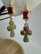 Small gold filigree cross earrings that are adorned with red green or clear rhinestones