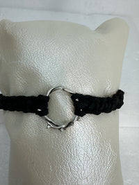 These silver crown of thorns bracelets are banded with black or red  macrome knots