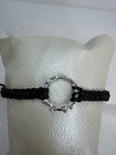 These silver crown of thorns bracelets are banded with black or red  macrome knots