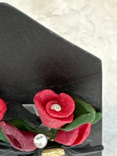 Red rose and lily handmade flower bouquet earrings secured in a black gold centered bow
