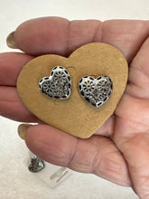 Silver plated heart shaped earrings engraved with flowers