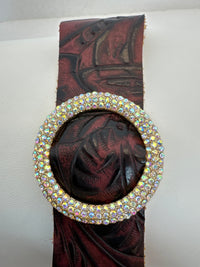 Rhinestone encrusted circle on embossed leather of different shades