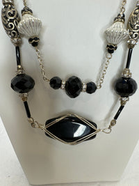 Black wire wrapped stone in a double strand necklace with silver and black beads