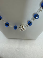 Three stranded blue bead and silver plated chain and beads