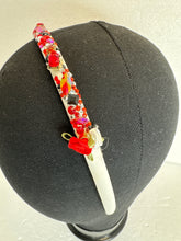 Glammed headbands. Decorated with resined flowers diamond dots and bling beads