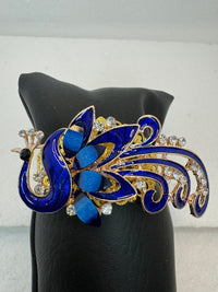 Peacock adorned bracelets in multi colors on gold or bronze adjustable bases