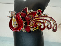 Peacock adorned bracelets in multi colors on gold or bronze adjustable bases