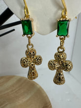 Small gold filigree cross earrings that are adorned with red green or clear rhinestones