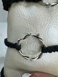 These silver crown of thorns bracelets are banded with black or red  macrome knots