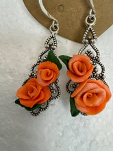 Handmade polymer clay roses on silver plated filigree teardrop pendants in earrings