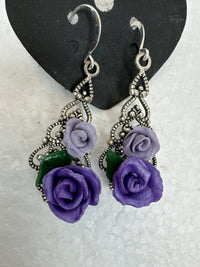 Handmade polymer clay roses on silver plated filigree teardrop pendants in earrings