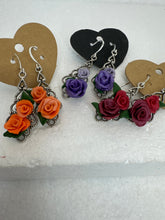 Handmade polymer clay roses on silver plated filigree teardrop pendants in earrings