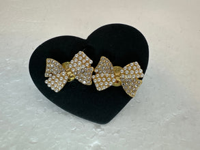 Pearl and rhinestone bow button earrings