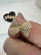 Pearl and rhinestone bow button earrings