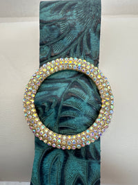 Rhinestone encrusted circle on embossed leather of different shades