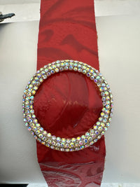 Rhinestone encrusted circle on embossed leather of different shades