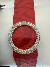 Rhinestone encrusted circle on embossed leather of different shades