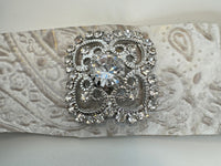 Embossed leather bracelets adorned with clear rhinestone vintage style pieces