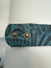 Embossed leather bracelets adorned with clear rhinestone vintage style pieces