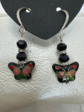 Cloisonné black butterfly earrings with another butterfly center