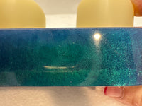 Chameleon colored resin candle holders