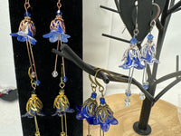 Hand painted lucite flower earring sets in varied colors