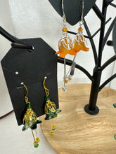 Hand painted lucite flower earring sets in varied colors
