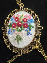 hand embroidered pendants made into beaded necklaces that can adorn any outfit
