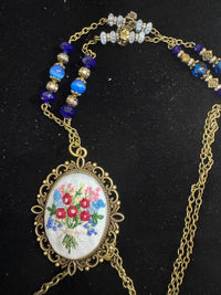hand embroidered pendants made into beaded necklaces that can adorn any outfit