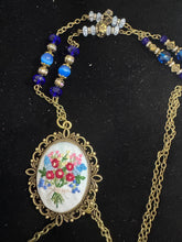 hand embroidered pendants made into beaded necklaces that can adorn any outfit
