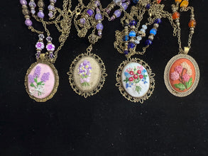 hand embroidered pendants made into beaded necklaces that can adorn any outfit