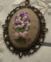 hand embroidered pendants made into beaded necklaces that can adorn any outfit