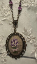 hand embroidered pendants made into beaded necklaces that can adorn any outfit